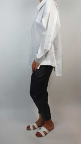 Women's white shirt with black tapered trousers