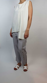 Danfi white top with grey tapered trousers side