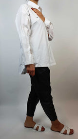 Women's white shirt with black tapered trousers side